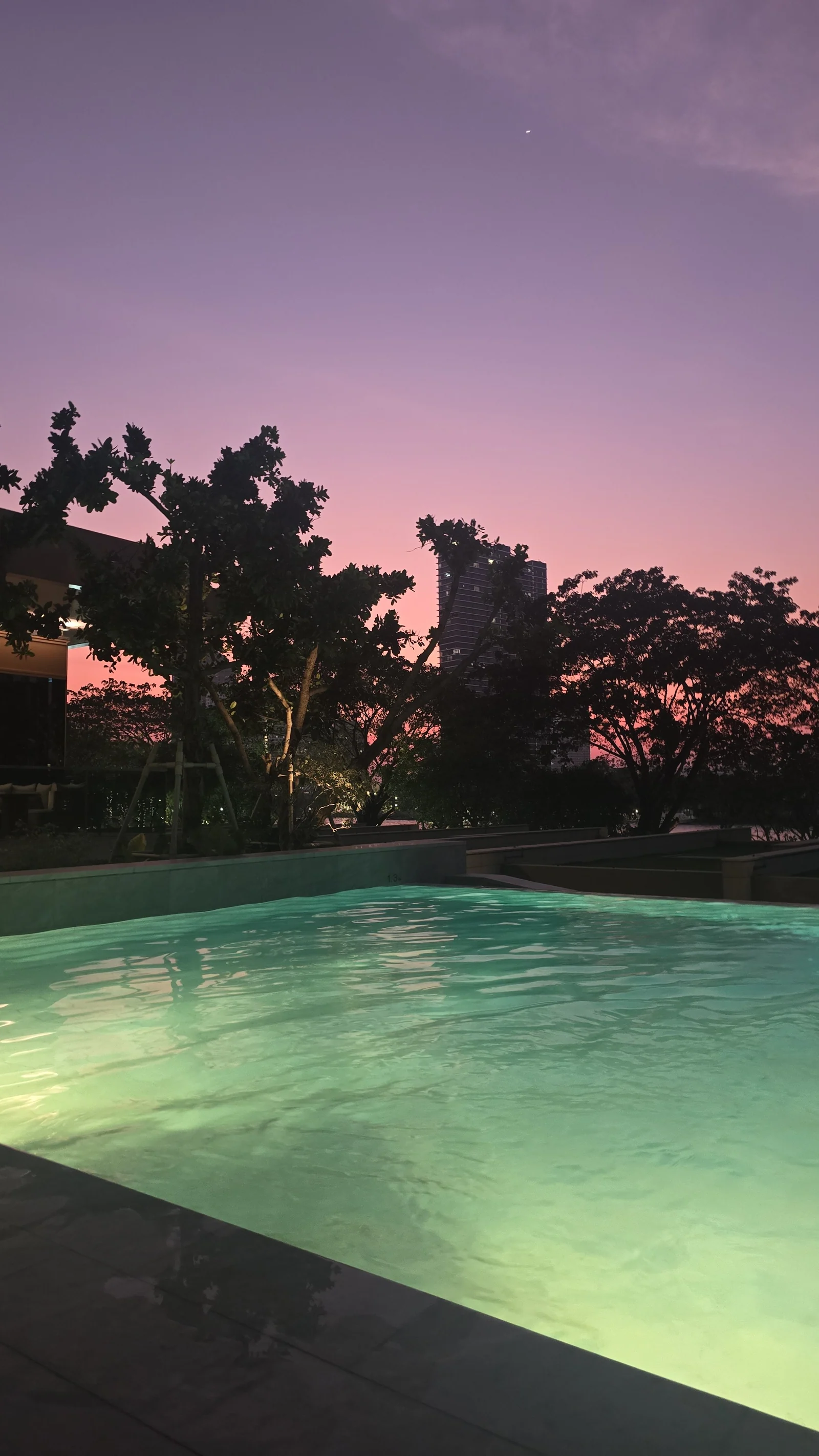 Capella Bangkok riverside pool at dusk from SuiteVerdict's February 2025 stay